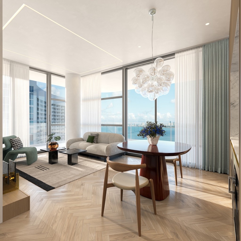 ELLE Residences oturma ve yemek alanı — körfez manzarası